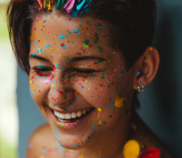 Sofia L., a painting teacher in a colorful art studio